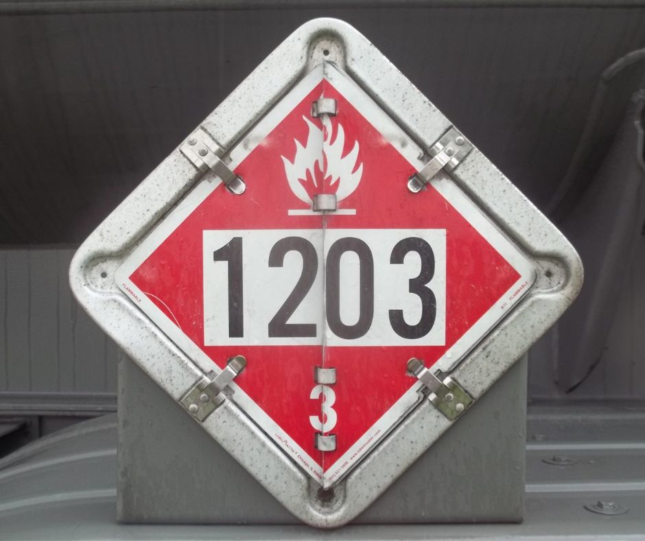 Placard displaying the number 1203 with a flame symbol.
